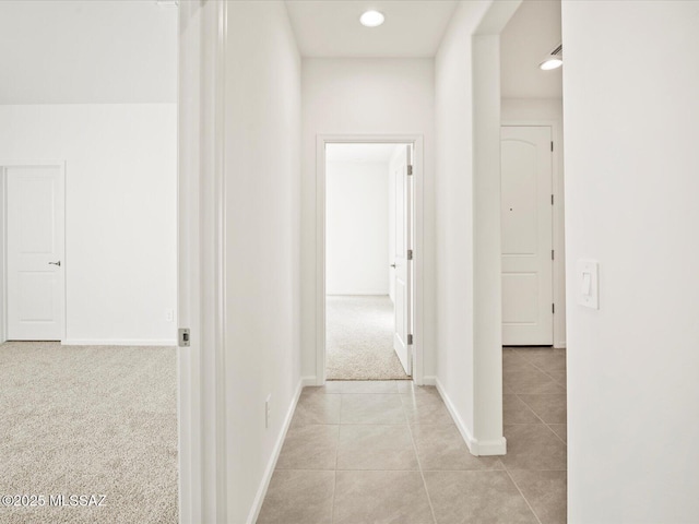 314 N Pecan Pie Pl, Sahuarita, AZ 85629 - hallway with light tile patterned floors, recessed lighting, light carpet, and baseboards