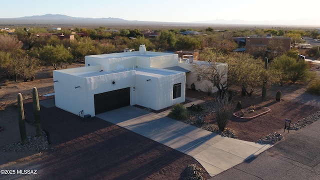 birds eye view of property with a mountain view