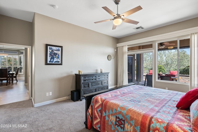 bedroom with light carpet, baseboards, visible vents, a ceiling fan, and access to exterior