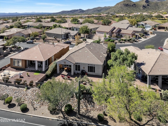 drone / aerial view with a residential view and a mountain view