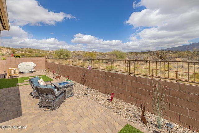 view of patio / terrace featuring a fire pit and a fenced backyard