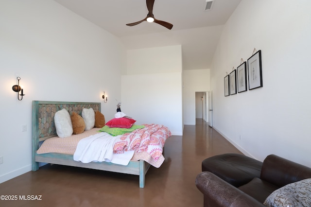 bedroom featuring finished concrete flooring, visible vents, a ceiling fan, high vaulted ceiling, and baseboards