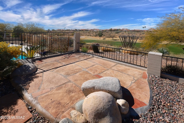 view of patio / terrace featuring fence