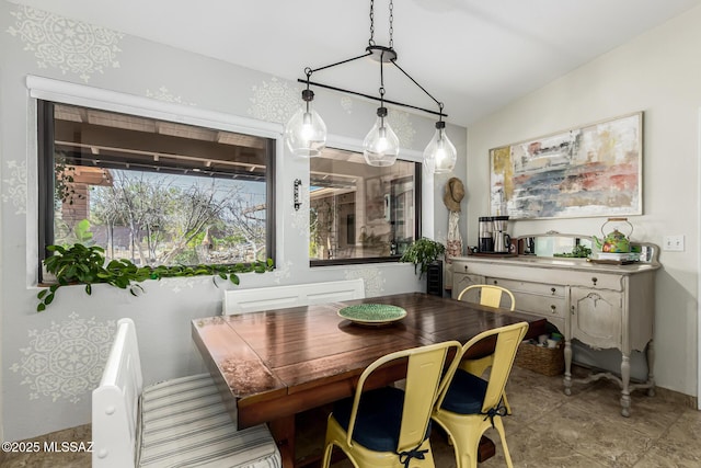 dining room with lofted ceiling