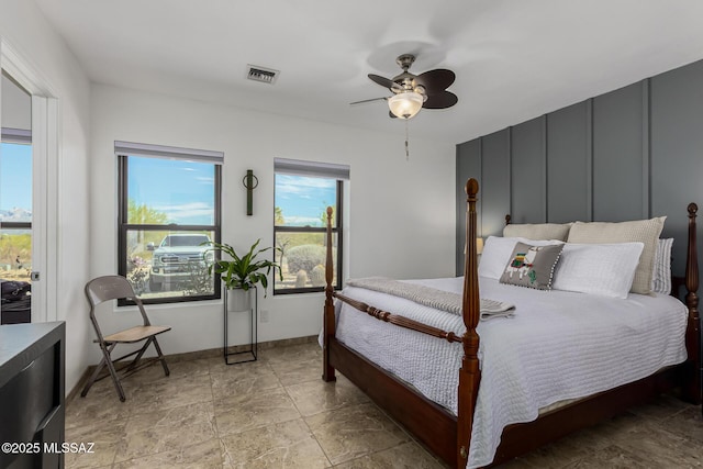 bedroom featuring visible vents, baseboards, and ceiling fan