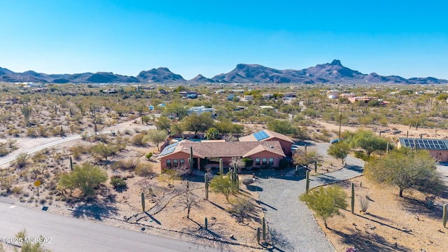 birds eye view of property with a mountain view