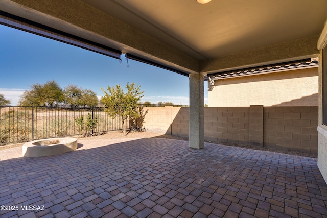 view of patio / terrace featuring a fire pit and a fenced backyard