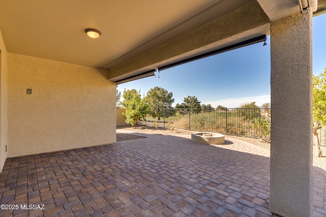 view of patio / terrace featuring a fire pit and a fenced backyard