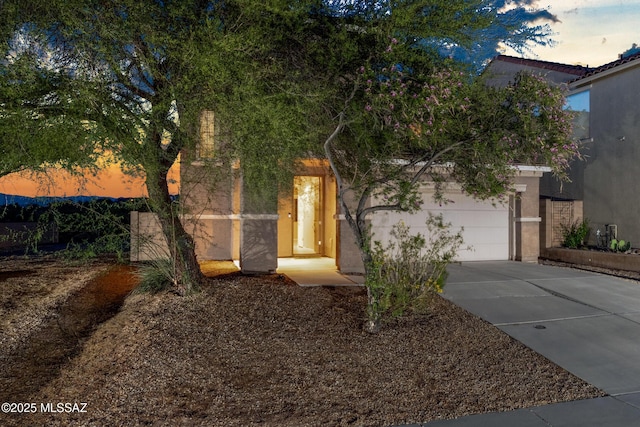 10365 S High Bluff Dr, Vail, AZ 85641 - view of front facade featuring driveway and stucco siding