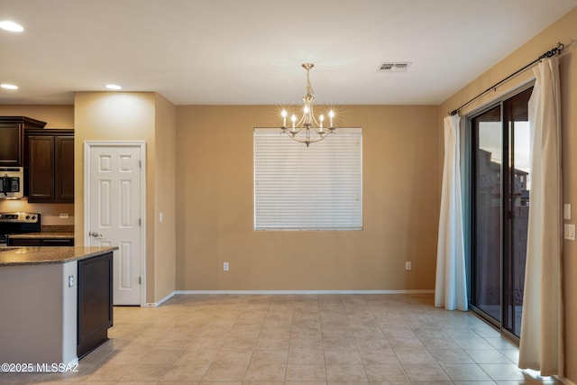 10365 S High Bluff Dr, Vail, AZ 85641 - kitchen with appliances with stainless steel finishes, dark brown cabinets, a chandelier, recessed lighting, and baseboards