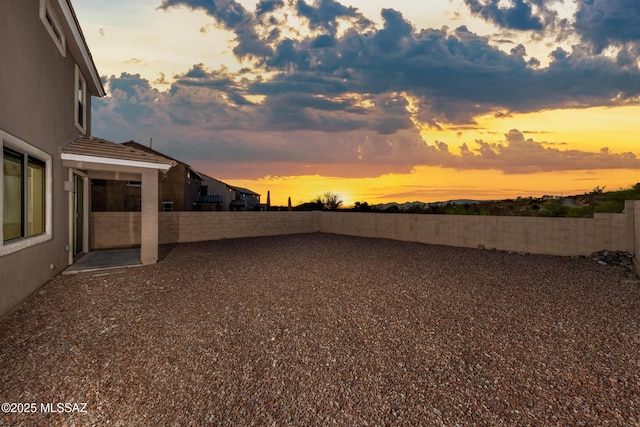 10365 S High Bluff Dr, Vail, AZ 85641 - yard at dusk featuring a fenced backyard