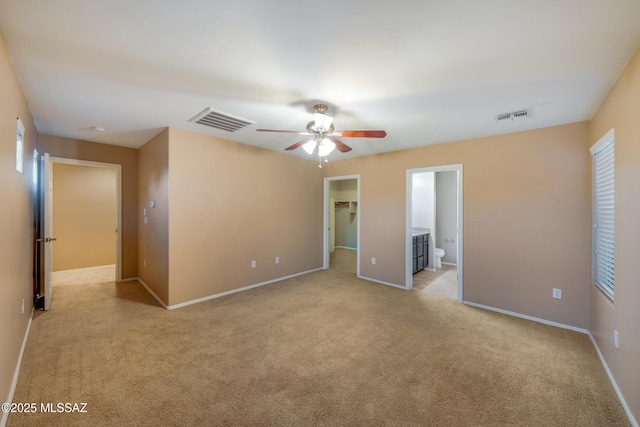 10365 S High Bluff Dr, Vail, AZ 85641 - unfurnished bedroom featuring light carpet, a spacious closet, baseboards, ceiling fan, and a closet