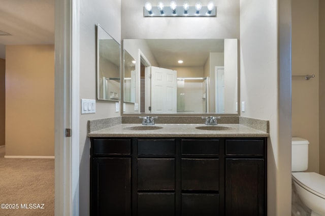 10365 S High Bluff Dr, Vail, AZ 85641 - bathroom featuring toilet, double vanity, and a shower with shower door
