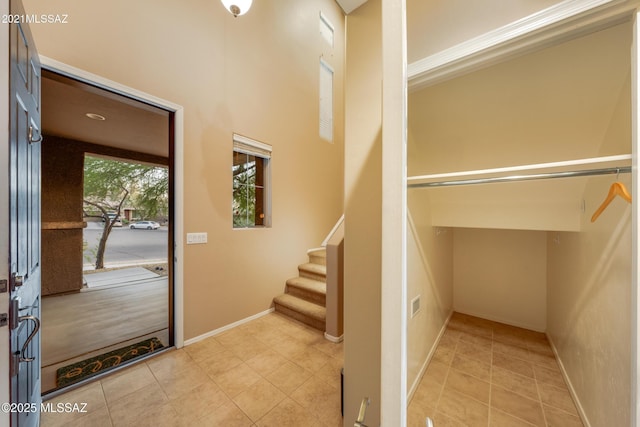 10365 S High Bluff Dr, Vail, AZ 85641 - foyer entrance featuring light tile patterned floors, stairs, and baseboards