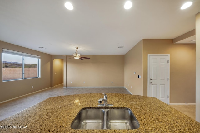10365 S High Bluff Dr, Vail, AZ 85641 - kitchen with a sink, a ceiling fan, stone counters, baseboards, and recessed lighting