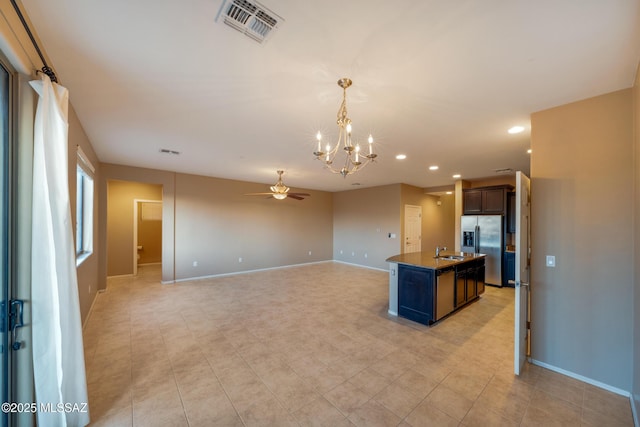 10365 S High Bluff Dr, Vail, AZ 85641 - kitchen with stainless steel fridge with ice dispenser, a sink, a ceiling fan, a chandelier, and recessed lighting