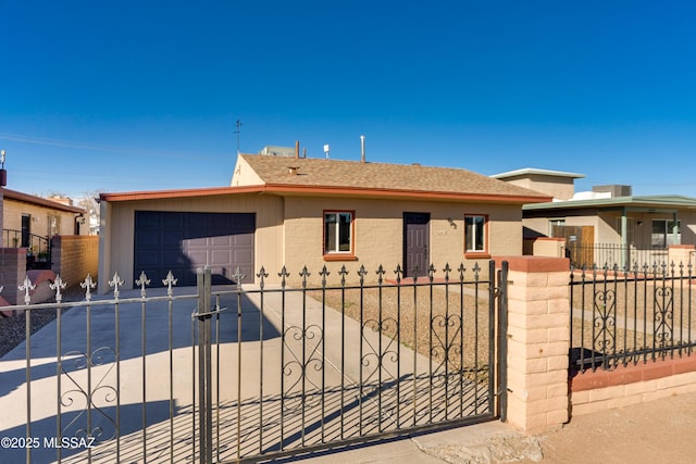 view of front of house featuring a fenced front yard, concrete driveway, brick siding, and an attached garage