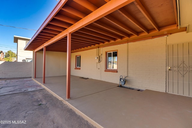 view of patio featuring fence