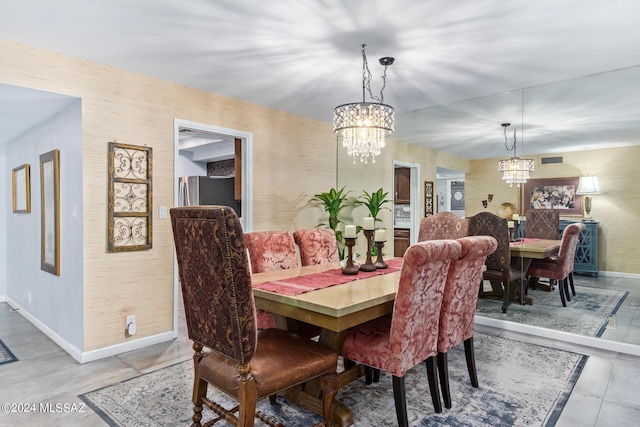 dining space with baseboards, wallpapered walls, and an inviting chandelier