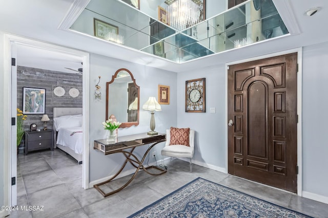 foyer entrance featuring baseboards and tile patterned floors