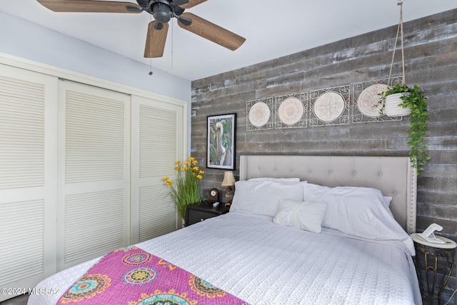 bedroom with ceiling fan and a closet