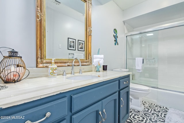 full bath with visible vents, bath / shower combo with glass door, toilet, tile patterned floors, and vanity