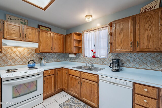 3021 E 2nd St, Tucson, AZ 85716 - kitchen with white appliances, under cabinet range hood, a sink, open shelves, and light countertops