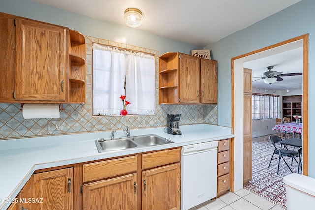 3021 E 2nd St, Tucson, AZ 85716 - kitchen with white dishwasher, open shelves, a sink, light countertops, and light tile patterned flooring