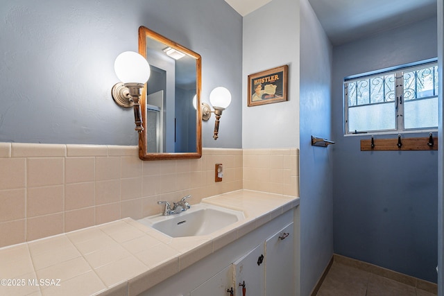 3021 E 2nd St, Tucson, AZ 85716 - bathroom featuring vanity, tile patterned flooring, and tasteful backsplash