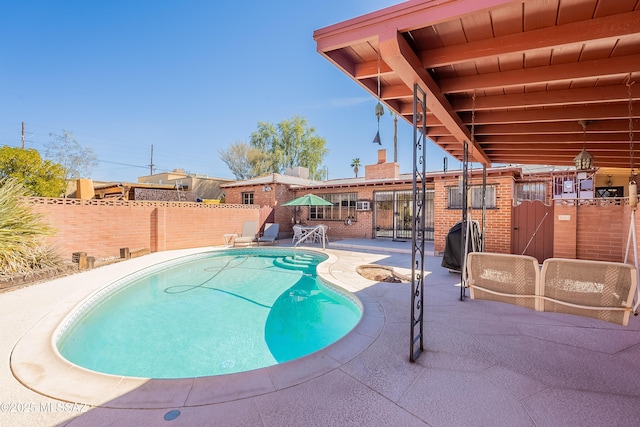 3021 E 2nd St, Tucson, AZ 85716 - view of swimming pool with a patio area and a fenced backyard