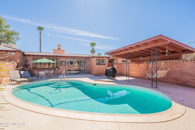 3021 E 2nd St, Tucson, AZ 85716 - view of swimming pool featuring a patio and fence