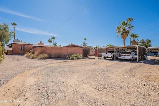 3021 E 2nd St, Tucson, AZ 85716 - manufactured / mobile home featuring driveway, fence, and brick siding