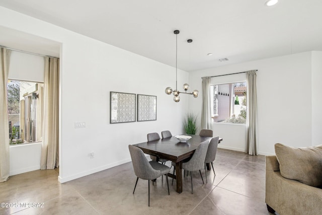 dining room with concrete flooring, recessed lighting, visible vents, and baseboards