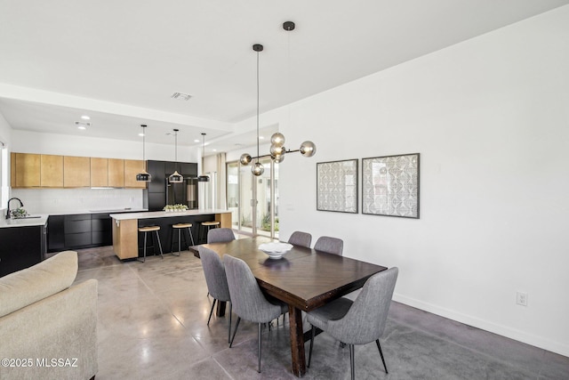 dining room featuring recessed lighting, visible vents, concrete floors, and baseboards