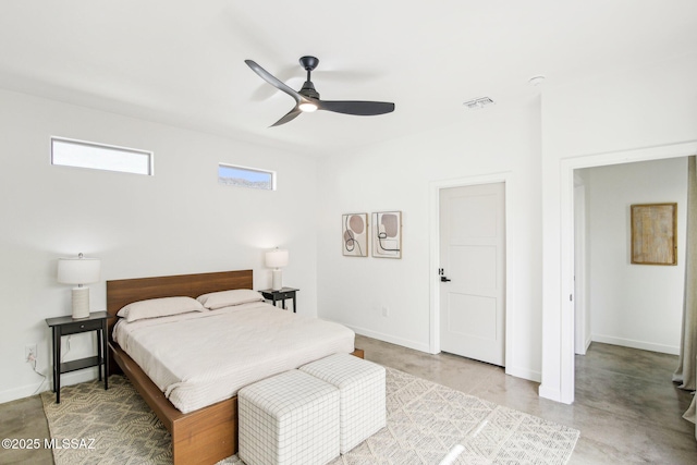 bedroom featuring finished concrete flooring, a ceiling fan, visible vents, and baseboards