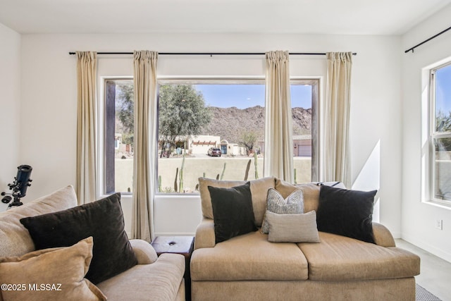 living room with a healthy amount of sunlight and baseboards