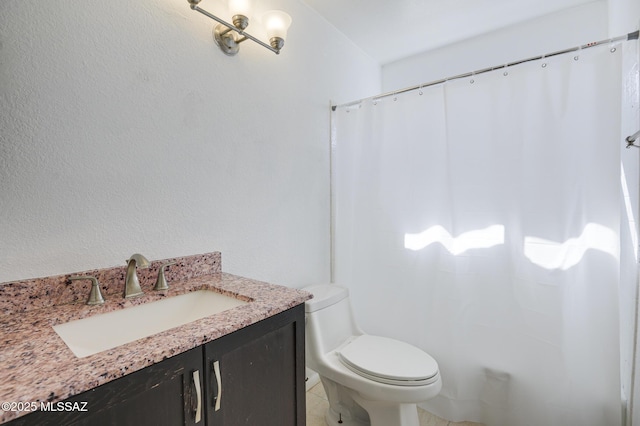 full bath with curtained shower, vanity, and toilet