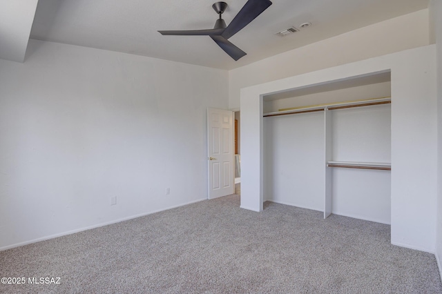 unfurnished bedroom featuring a ceiling fan, a closet, visible vents, and carpet flooring