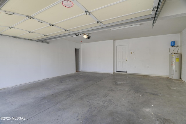 garage featuring electric water heater and a garage door opener