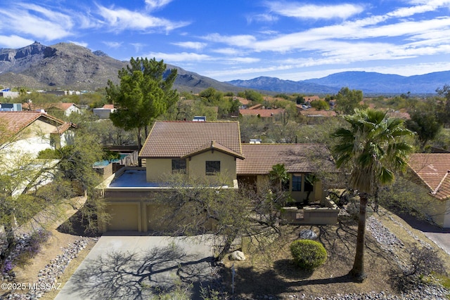 birds eye view of property with a mountain view