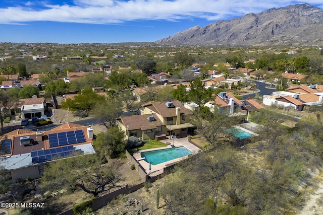 drone / aerial view with a residential view and a mountain view