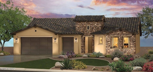 view of front of property with an attached garage, stone siding, driveway, and a tiled roof