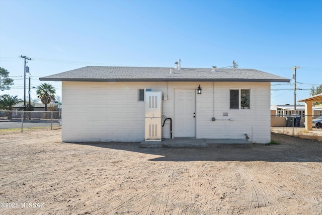 back of property with fence