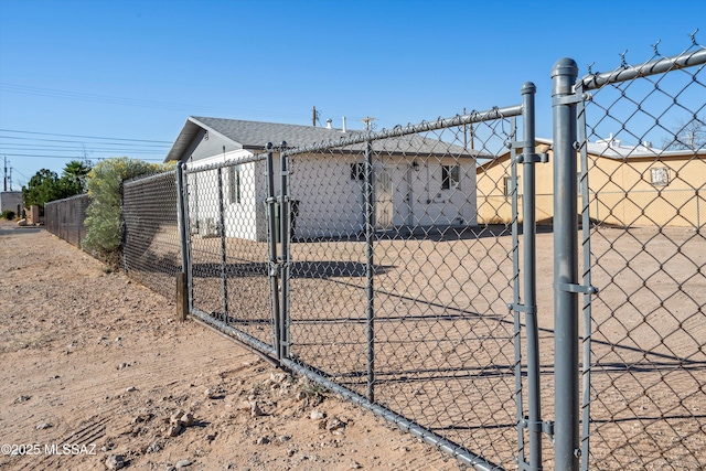 view of gate featuring fence