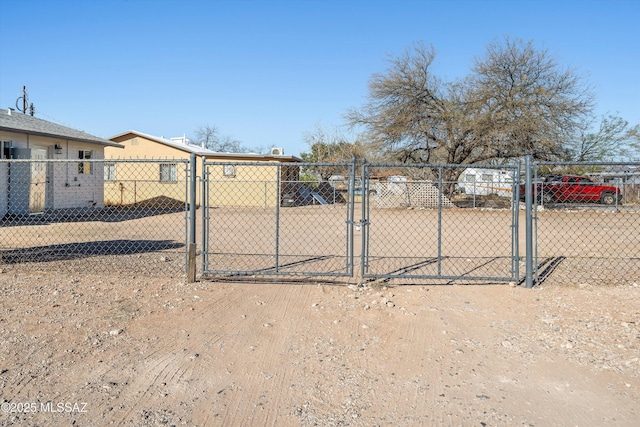 view of gate featuring fence