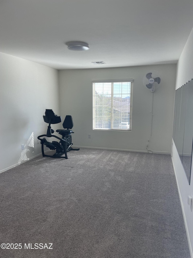 interior space featuring carpet, visible vents, and baseboards