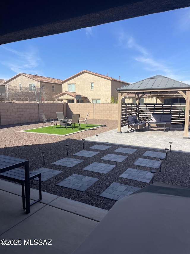 view of patio / terrace with a fenced backyard and a gazebo