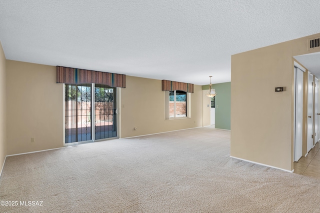 unfurnished room with plenty of natural light and light colored carpet