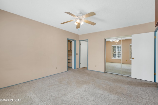 unfurnished bedroom featuring carpet floors and a ceiling fan