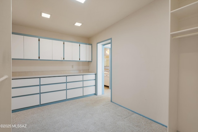 empty room featuring light colored carpet